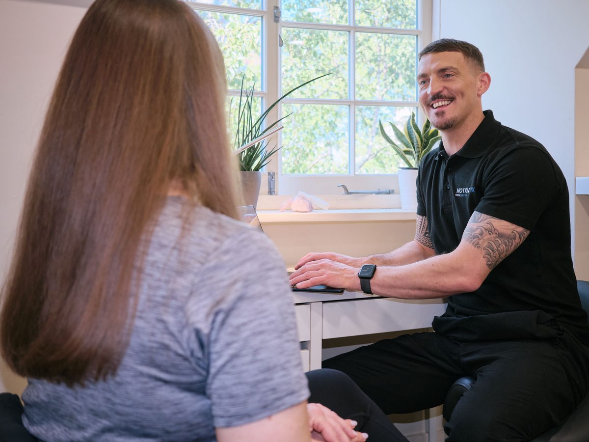 Owain Evans, Doctor of Chiropractic and founder of MotionFix, with a patient