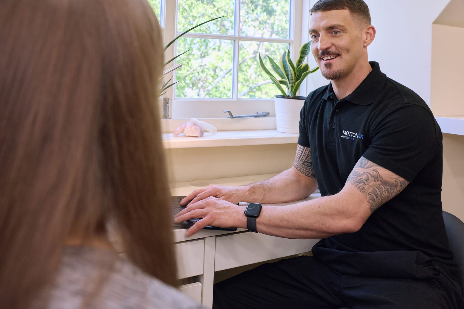 Owain Evans, Doctor of Chiropractic, with a patient at MotionFix in Elephant & Castle